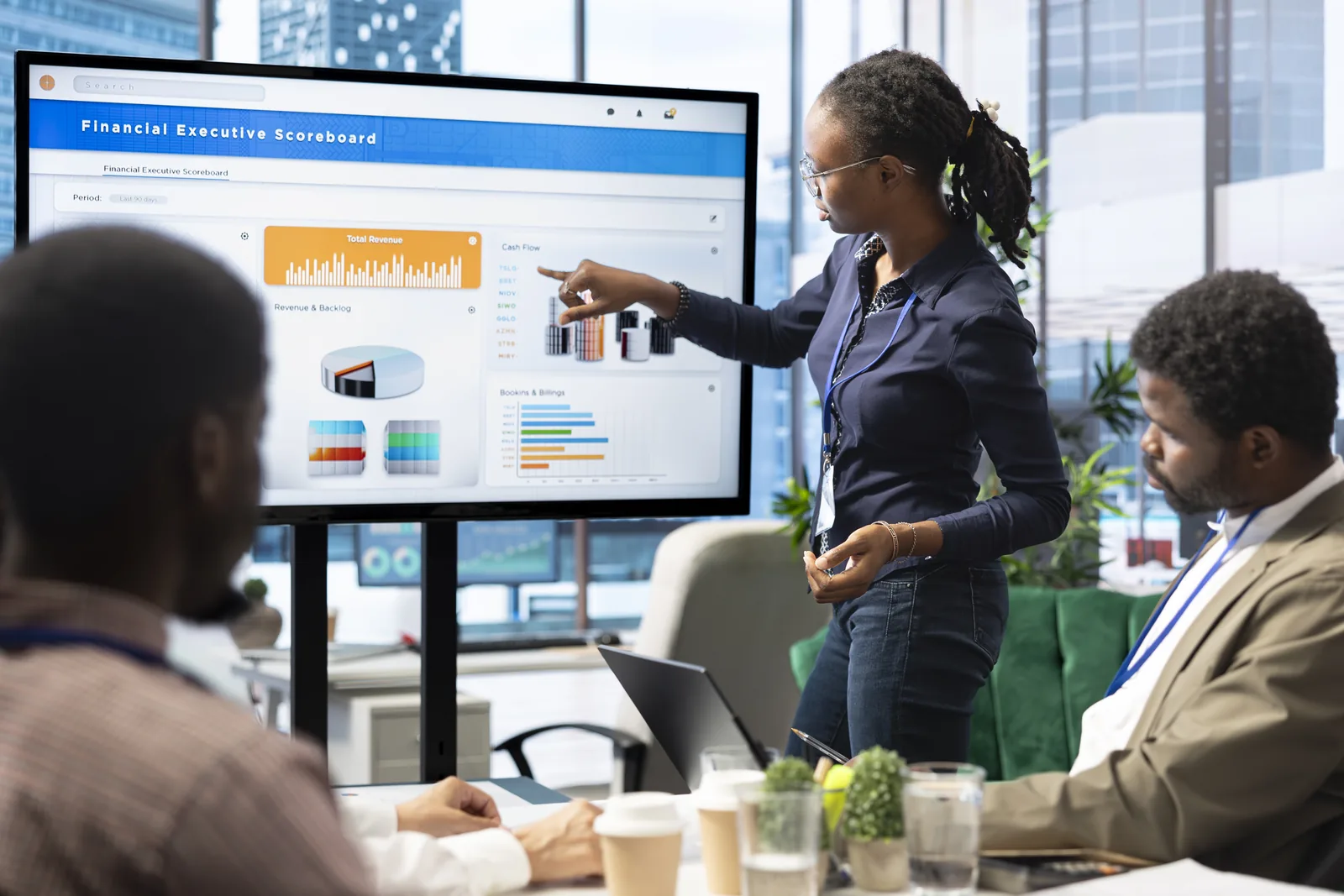 A team reviewing business analytics on a dashboard