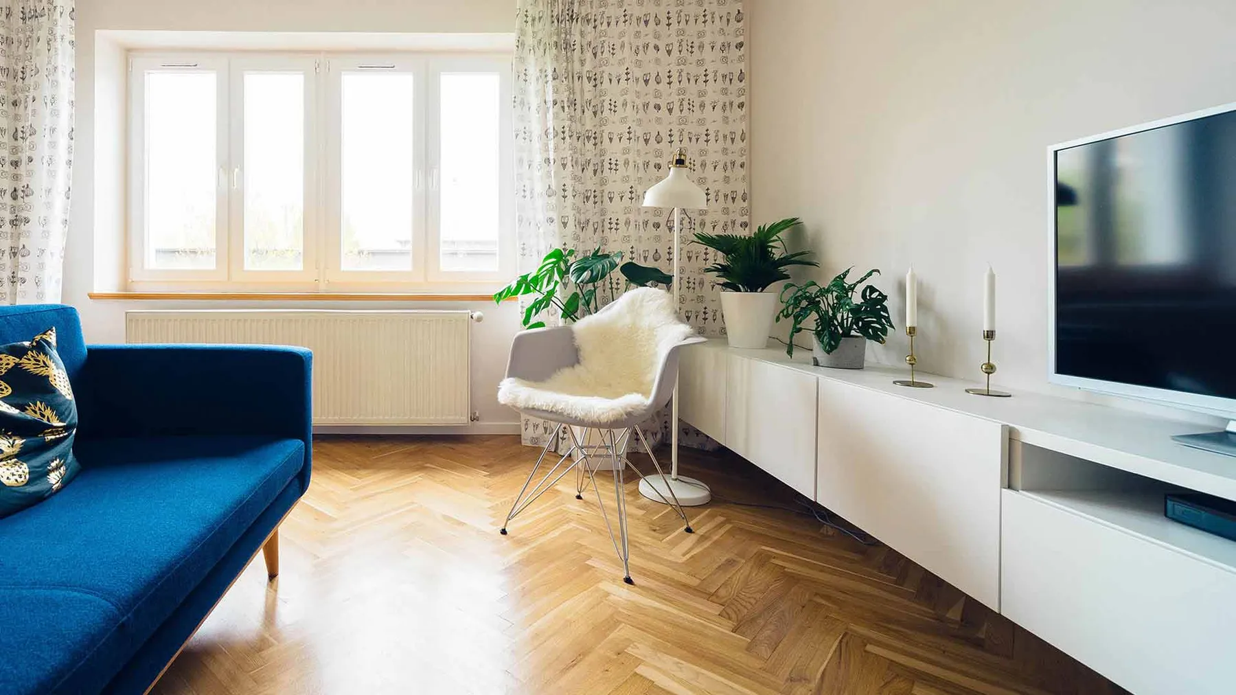 A bright, furnished living room in a rental apartment